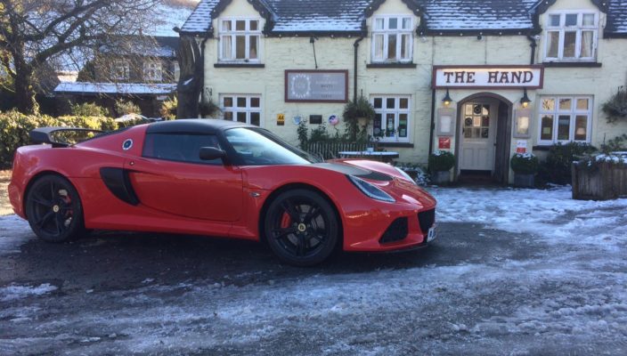 Lotus Exige Sport 350 outside snowy The Hand Hotel at Llanarmon